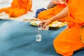 Thai monk pray and pouring water buddhist ritual