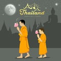 Thai Monks and novice in Buddhist light waving rite