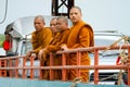 Thai monks in traditional orange clothes