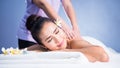 Thai oil back spiral massage to woman in spa Royalty Free Stock Photo