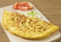 Thai Omelette with Tomatoes and Scallion on Wooden Board Royalty Free Stock Photo