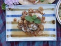 Thai oyster salad with fried garlic and mint Royalty Free Stock Photo