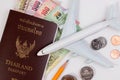 Thai Passport with Thai money banknote, Thai coin and airplane. Royalty Free Stock Photo