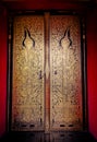 Thai pattern on door in Thailand Buddha Temple Asian style art. Royalty Free Stock Photo