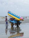 Thai people carrying rubber boat on the beach of Si Racha