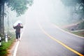 Thai people carrying sack walking at beside road countryside