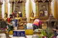 Thai people and foreign traveler respect praying and rite ritual god angel buddha statue at Wat Bang Phli Yai Nai Temple in Bang Royalty Free Stock Photo