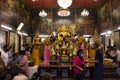 Thai people and foreign traveler respect praying and rite ritual god angel buddha statue at Wat Bang Phli Yai Nai Temple in Bang Royalty Free Stock Photo