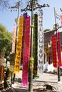 Thai people and foreign travelers hanging holy flags or colorful Tung Flag of Lanna or northern of thai for respect praying