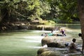 Thai people foreigner travel relax and play swimming in Namtok Chet Sao Noi small waterfall in Saraburi, Thailand