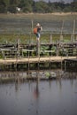 Thai people and foreigner travelers travel and walking visit on Kae Dam long wood bridge at Maha Sarakham, Thailand