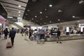 Thai people and foreigner travelers wait receive luggage on carousel conveyor at Udon Thani International Airport in Thailand Royalty Free Stock Photo