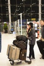 Thai people and foreigner travelers walking and wait at Suvarnabhumi international airport with passengers arriving and departing