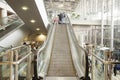 Thai people and foreigner traveller use escalators up and down f