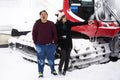 Thai people husband and wife travel and posing for take photo with Snowploughs machine