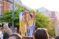 Thai people lift His Majesty King Bhumibol Adulyadej