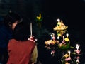 thai people pray and hold hand made krathong by flower from loykratong festival and thailand culture on november