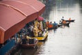 Thai people praying put food and thing offerings to monks procession on boat in tradition of almsgiving at Wat Sai Yai on November Royalty Free Stock Photo