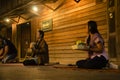 Thai people put food offerings to monks procession walk on the road