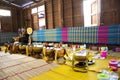 Thai people put food offerings of tradition of almsgiving with sticky rice and food to Buddhist alms bowl at Retro house on