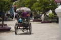 Thai people reding vintage retro tricycle bike or rickshaw of thai style