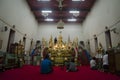 Thai people respect praying and gild cover with gold leaf on Luang Pho Ban Laem Royalty Free Stock Photo