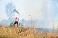 Thai People use branch and leaf extinguish Smoke and flames Royalty Free Stock Photo