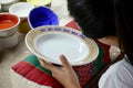 Thai people woking process paint Ceramic Benjarong is traditiona
