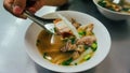 Thai peppery soup and crispy pork, called Kuay Jab clear soup. Noodle roll soup, like a traditional Thai style breakfast but come Royalty Free Stock Photo