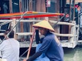 Thai person is sitting in a boat