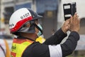 Thai police photographs on the smartphone procession during the Vegetarian Festival at Phuket Town. Thailand