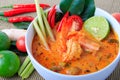 Thai Prawn Soup with Lemongrass (Tom Yum Goong) On Brown Cloth Background.