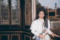 The lady in Middle Thai classical traditional dress suit posing indoor at old railway station building. Royalty Free Stock Photo