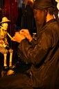 Thai professional puppeteer or Puppet master manipulate playing acting ancient puppets toy or antique marionette on stage for show