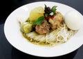 Thai rice flour noodles put beside chicken green curry Royalty Free Stock Photo