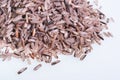 Thai Riceberry rice : Close-up pile of rice called riceberry rice , rice with high nutrients  on white background Royalty Free Stock Photo