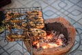 Thai river prawns grilled over charcoal grill Grilled on a BBQ Thai iron grill . Giant grilled lobster cook on charcoal stove at T