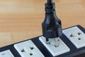 Thai 2 round power pins plug with earth pin plugging in compatible extension cord