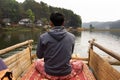 Thai rower waterman rowing bamboo rafts in Pang Ung lake for service travelers people travel visit Pang Oung or Switzerland of