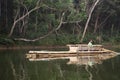 Thai rower waterman rowing bamboo rafts in Pang Ung lake for service travelers people travel visit Pang Oung or Switzerland of