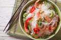 Thai salad with glass noodles, prawns and peanuts close-up. horizontal top view Royalty Free Stock Photo