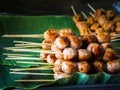 Thai sausage and grilled on banana leaf ready for sale in Thailand street food Royalty Free Stock Photo