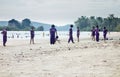 Thai schoolkids playing at the beach