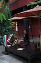 Thai silk weaving by a beautiful lady at Jim Thomson House, Bangkok