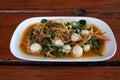 Thai sizzling spicy fried scallop serves on the dish