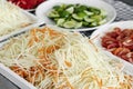 Thai som tam papaya salad ingredients at catering buffet table Royalty Free Stock Photo