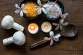 Thai spa composition treatments aroma therapy with candles and Plumeria flowers Royalty Free Stock Photo