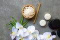 Thai Spa.  Massage spa and hot stones setting for treatment and relax with white orchid on blackboard.  Lifestyle Healthy Concept, Royalty Free Stock Photo
