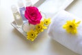 Thai Spa relax Treatments and massage with pink rose and yellow flower on wooden white. Healthy Concept