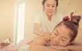 Thai Spa Therapist is kindly massaging woman back